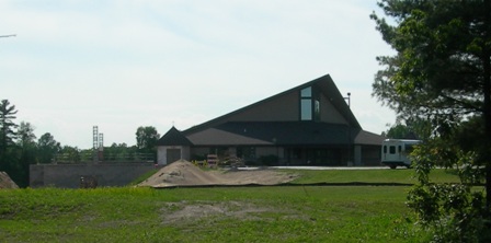 picture of front elevation of Word of Life Church taken from across the entrance road to the property - the lower walls of the addition are barely visible