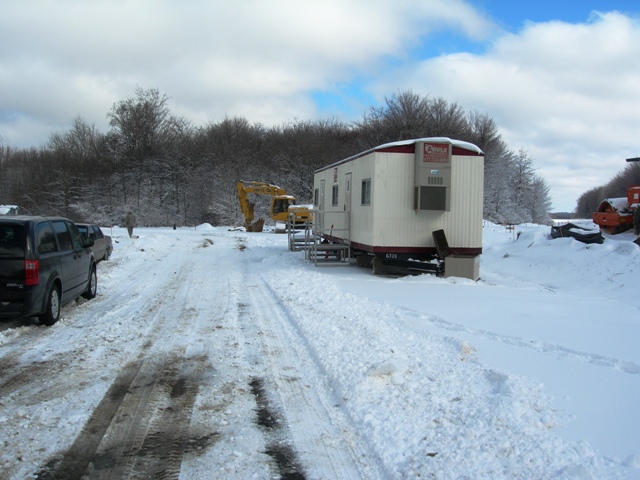picture of construction trailer on snow covered site
