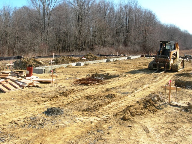 picture of construction equipment and foundation walls