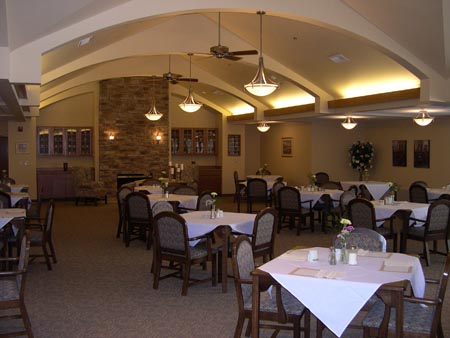 interior photo of Tawas Village Assisted Living Facility - community dining room with curved ceiling arch beams in cathedral ceiling