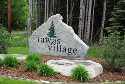 picture of custom stone sign which is erected at the entrance to Tawas Village Assisted Living Facility