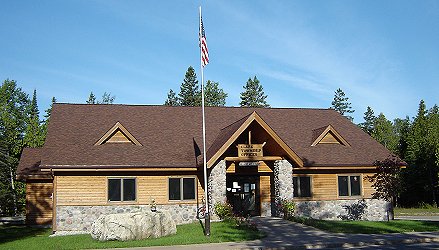 Clark Township Hall in Cedarville (in Michigan's Upper Peninsula) building is log sided on upper walls with fieldstone on lower walls, and architectural shingle roof