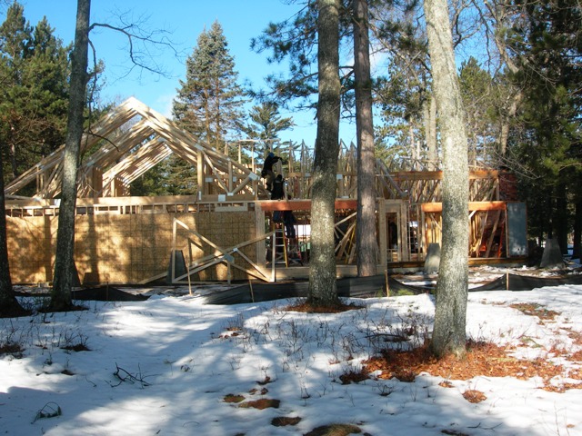 picture of exterior wall and roof framing in progress on Lake Margrethe home
