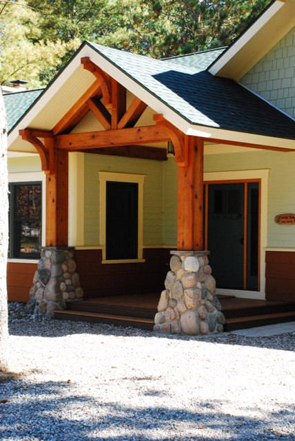 picture of fieldstone and timber columns at main entry porch
