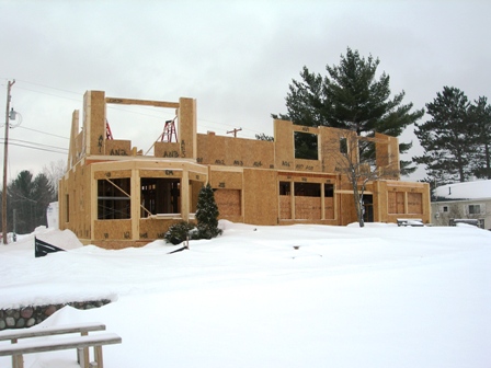 picture taken from lakeside elevation - second floor SIP panels are being erected for custom home on Otsego Lake