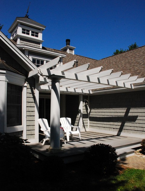 picture of front entrance pergola and deck chairs