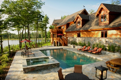 picture of swimming pool, stone deck and spa for Ward Lake Residence in Gaylord, Michigan