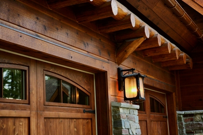 picture of custom timber-framed wood garage doors for Ward Lake Residence, Gaylord, Michigan 